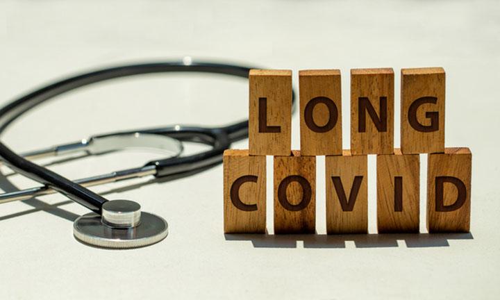 Stethoscope and wooden blocks with wording "LONG COVID"